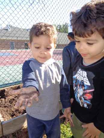 3 Year Old Preschoolers Planting on Earth Day