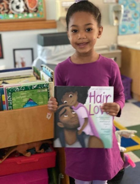 Student with Hair Love book for book day