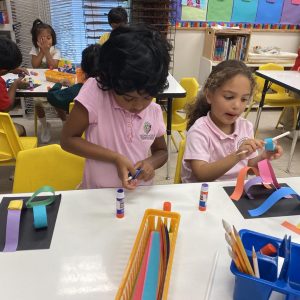 Students doing a construction paper building activity