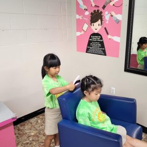 students learning about being hairstylists