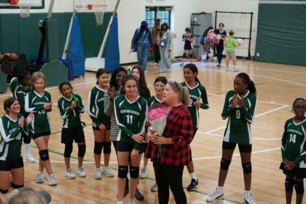 Girls Wildcat Volleyball Team Coach Accepting Award